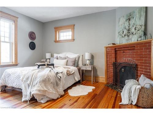 91 Daly Avenue, Stratford, ON - Indoor Photo Showing Bedroom With Fireplace