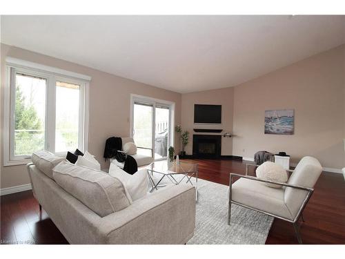 24-90 Ontario Street S, Grand Bend, ON - Indoor Photo Showing Living Room With Fireplace