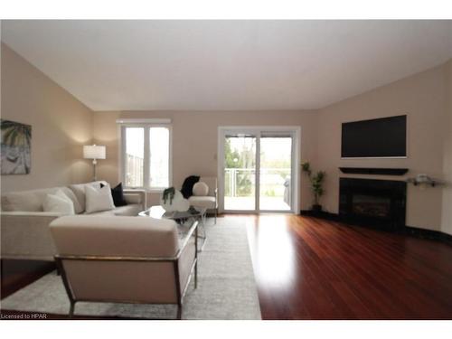 24-90 Ontario Street S, Grand Bend, ON - Indoor Photo Showing Living Room With Fireplace