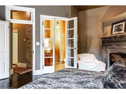 51 Shrewsbury Street, Stratford, ON - Indoor Photo Showing Bedroom With Fireplace