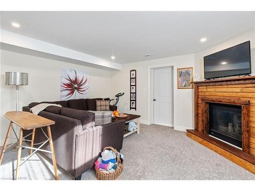 19 Pickett Court, Mitchell, ON - Indoor Photo Showing Living Room With Fireplace