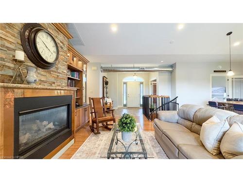 6055 Fischer Road, Mitchell, ON - Indoor Photo Showing Living Room With Fireplace