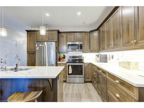 58-375 Mitchell Road South, Listowel, ON - Indoor Photo Showing Kitchen With Stainless Steel Kitchen With Double Sink With Upgraded Kitchen