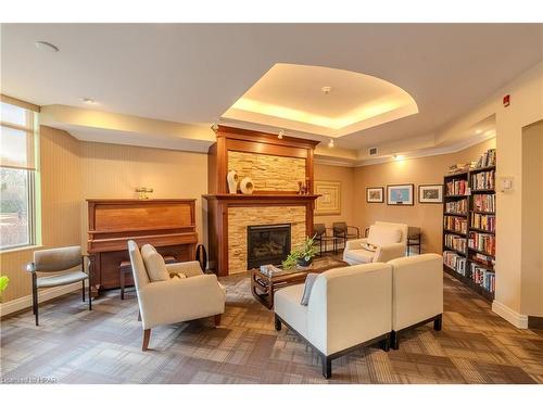 212-400 Romeo Street N, Stratford, ON - Indoor Photo Showing Living Room With Fireplace