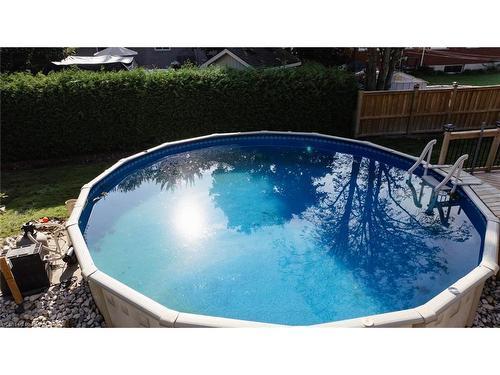 223 Coulton Drive, Mitchell, ON - Outdoor With Above Ground Pool With Backyard