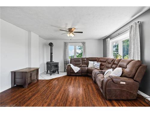 6140 3Rd Line, Minto, ON - Indoor Photo Showing Living Room With Fireplace