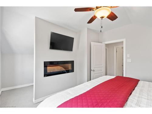 6140 3Rd Line, Minto, ON - Indoor Photo Showing Bedroom With Fireplace