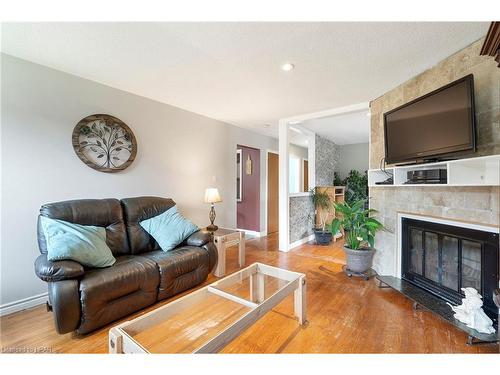 27 Hines Crescent, London, ON - Indoor Photo Showing Living Room With Fireplace