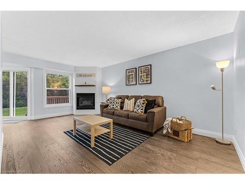 2-401 Springbank Avenue, Woodstock, ON - Indoor Photo Showing Living Room With Fireplace