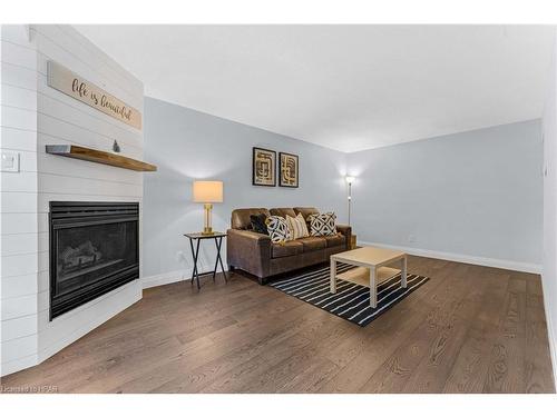 2-401 Springbank Avenue, Woodstock, ON - Indoor Photo Showing Living Room With Fireplace