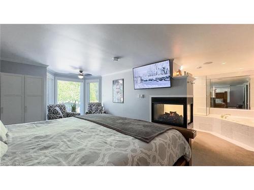 76000 London Road, Brucefield, ON - Indoor Photo Showing Bedroom With Fireplace