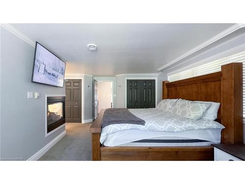 76000 London Road, Brucefield, ON - Indoor Photo Showing Bedroom With Fireplace