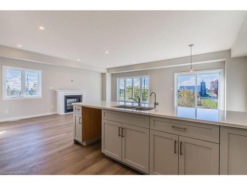 149 Mill Race Crescent, St. Jacobs, ON - Indoor Photo Showing Kitchen With Fireplace With Double Sink