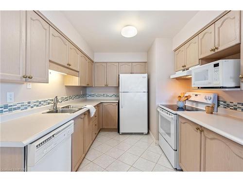 101-9 Pine Street, Grand Bend, ON - Indoor Photo Showing Kitchen With Double Sink