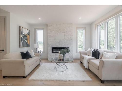 104 Greene Street, Exeter, ON - Indoor Photo Showing Living Room With Fireplace