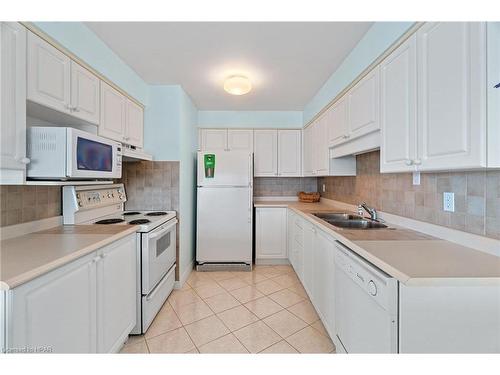 202-9 Pine Street, Grand Bend, ON - Indoor Photo Showing Kitchen With Double Sink