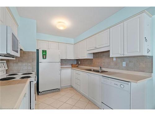 202-9 Pine Street, Grand Bend, ON - Indoor Photo Showing Kitchen With Double Sink