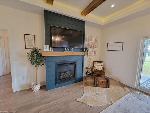 4557 Perth Road 180, Dublin, ON - Indoor Photo Showing Living Room With Fireplace