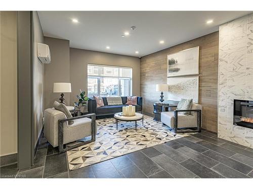 405-235 John Street N, Stratford, ON - Indoor Photo Showing Living Room With Fireplace