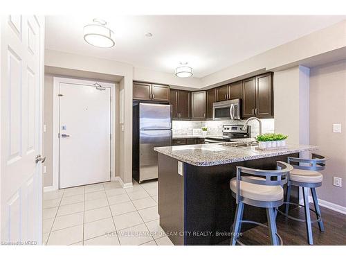 211-1045 Nadalin Heights, Milton, ON - Indoor Photo Showing Kitchen With Stainless Steel Kitchen With Upgraded Kitchen