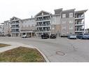 211-1045 Nadalin Heights, Milton, ON  - Outdoor With Balcony With Facade 