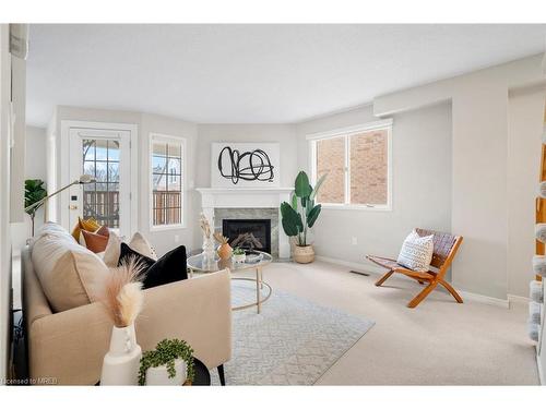 207-2055 Walkers Line, Burlington, ON - Indoor Photo Showing Living Room With Fireplace