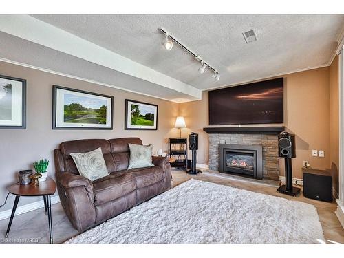 57 Decarie Circle, Toronto, ON - Indoor Photo Showing Living Room With Fireplace