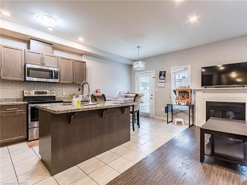 61 Sonoma Valley Crescent, Hamilton, ON - Indoor Photo Showing Kitchen With Fireplace With Stainless Steel Kitchen With Upgraded Kitchen