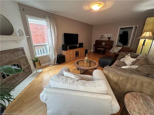 28 Huntingwood Avenue, Hamilton, ON - Indoor Photo Showing Living Room With Fireplace