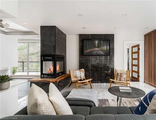 613 Long Lake Road, Novar, ON - Indoor Photo Showing Living Room With Fireplace