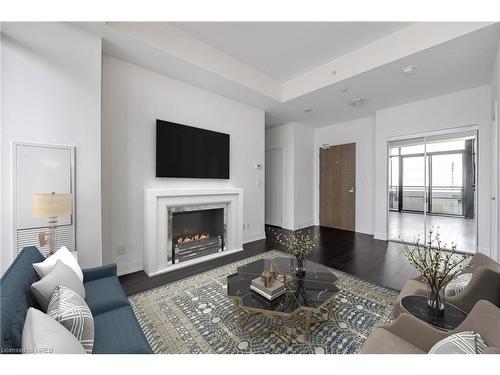 509-2910 Highway 7, Vaughan, ON - Indoor Photo Showing Living Room With Fireplace