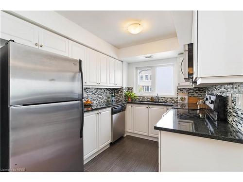 203-1005 Nadalin Heights, Milton, ON - Indoor Photo Showing Kitchen With Stainless Steel Kitchen