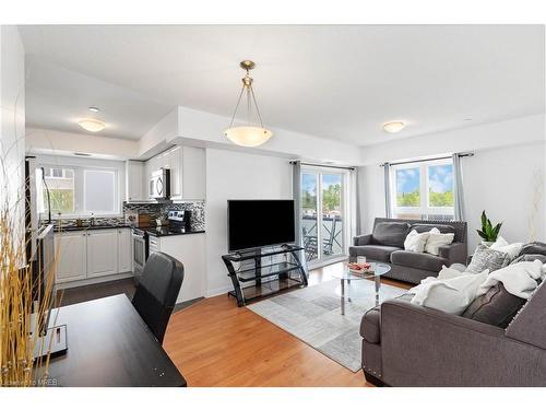 203-1005 Nadalin Heights, Milton, ON - Indoor Photo Showing Living Room