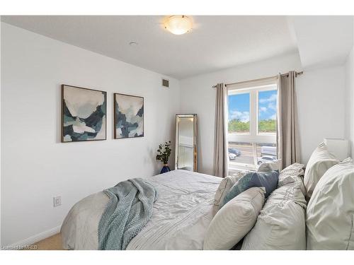 203-1005 Nadalin Heights, Milton, ON - Indoor Photo Showing Bedroom