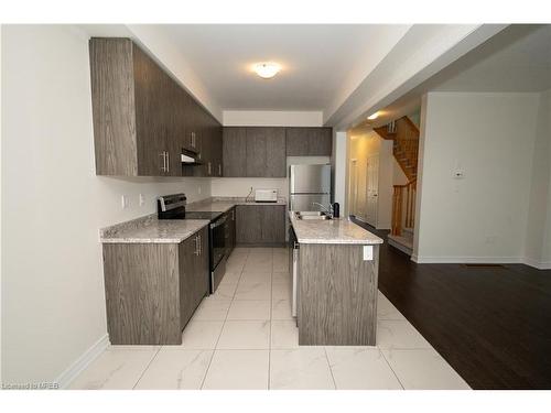 1-166 Deerpath Drive, Guelph, ON - Indoor Photo Showing Kitchen With Double Sink