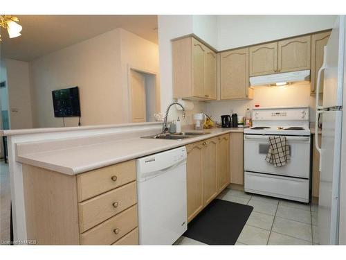 101-2565 Erin Centre Boulevard, Mississauga, ON - Indoor Photo Showing Kitchen With Double Sink