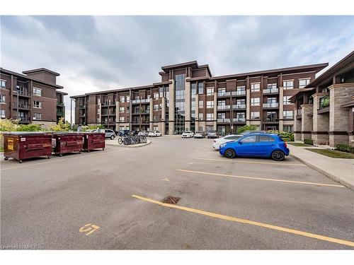 107-5020 Corporate Drive, Burlington, ON - Outdoor With Balcony With Facade