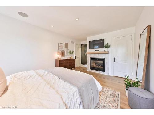 1647 Woodeden Drive, Mississauga, ON - Indoor Photo Showing Bedroom With Fireplace