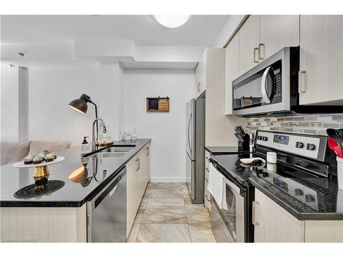 302-2486 Old Bronte Road, Oakville, ON - Indoor Photo Showing Kitchen With Stainless Steel Kitchen With Double Sink With Upgraded Kitchen