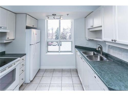 209-4640 Kimbermount Avenue, Mississauga, ON - Indoor Photo Showing Kitchen With Double Sink