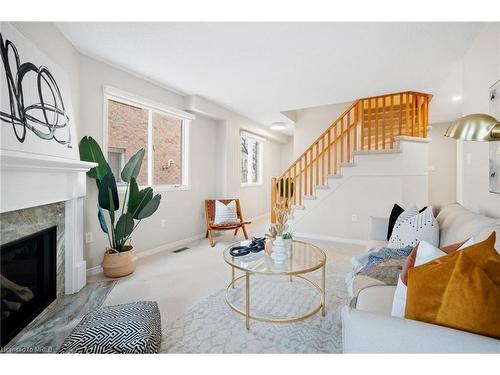 207-2055 Walkers Line, Burlington, ON - Indoor Photo Showing Living Room With Fireplace