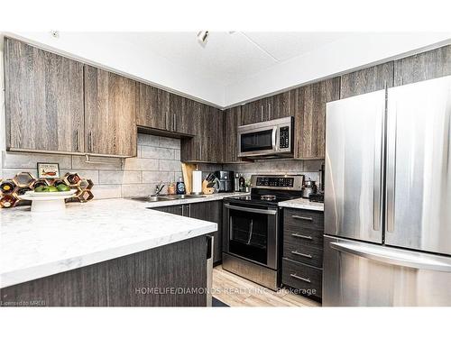 306-1450 Bishops Gate, Oakville, ON - Indoor Photo Showing Kitchen With Stainless Steel Kitchen