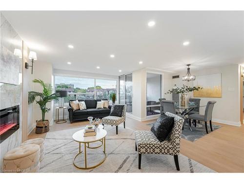 214-475 The West Mall, Toronto, ON - Indoor Photo Showing Living Room With Fireplace