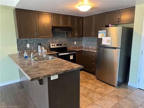 209-67 Kingsbury Square, Guelph, ON - Indoor Photo Showing Kitchen With Double Sink