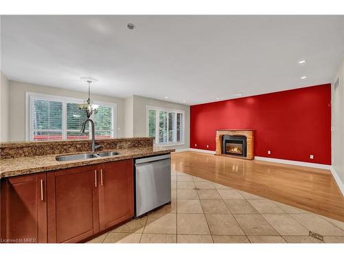 88 41St Street S, Wasaga Beach, ON - Indoor Photo Showing Kitchen With Fireplace With Double Sink