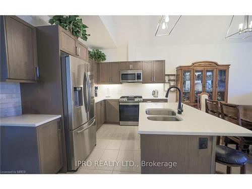 7-63 Compass Trail, Port Stanley, ON - Indoor Photo Showing Kitchen With Double Sink