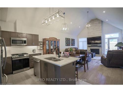 7-63 Compass Trail, Port Stanley, ON - Indoor Photo Showing Kitchen With Fireplace With Double Sink With Upgraded Kitchen