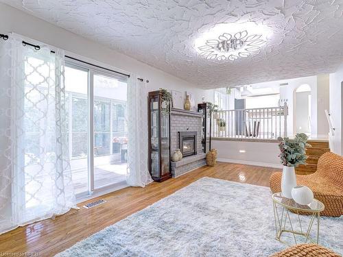 568 Canewood Crescent, Waterloo, ON - Indoor Photo Showing Living Room With Fireplace