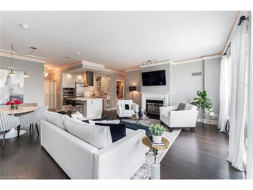 Ph404-88 Palace Pier Court, Toronto, ON - Indoor Photo Showing Living Room With Fireplace