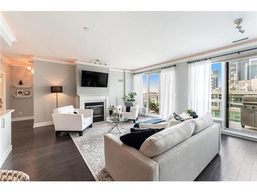 Ph404-88 Palace Pier Court, Toronto, ON - Indoor Photo Showing Living Room With Fireplace